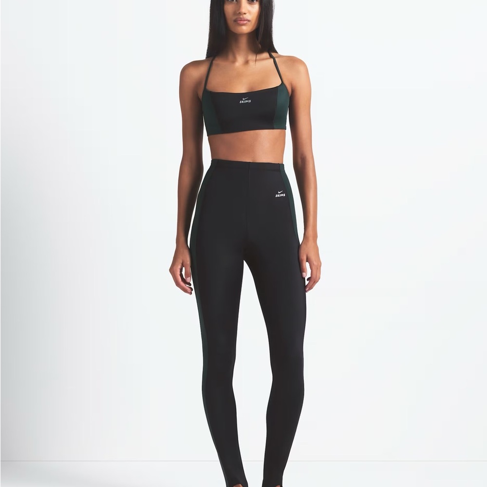 SKIMS Black Leggings with Dark Green Side Panels